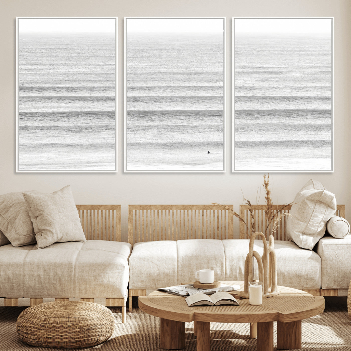 Monochrome photo of a lone surfer in calm layered waves, perfect for minimalist coastal or moody ocean-inspired wall decoration.