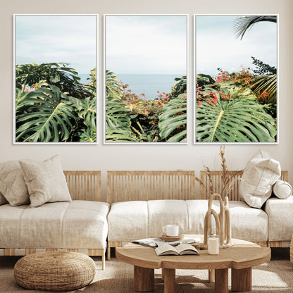 Monstera leaves and tropical flowers framing a calm ocean view, ideal for tropical coastal or exotic jungle-style interior wall decor.