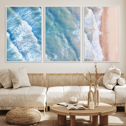 Aerial photo of soft blue waves meeting sandy shore, perfect for modern coastal or beach-themed decor with a light and tranquil aesthetic.