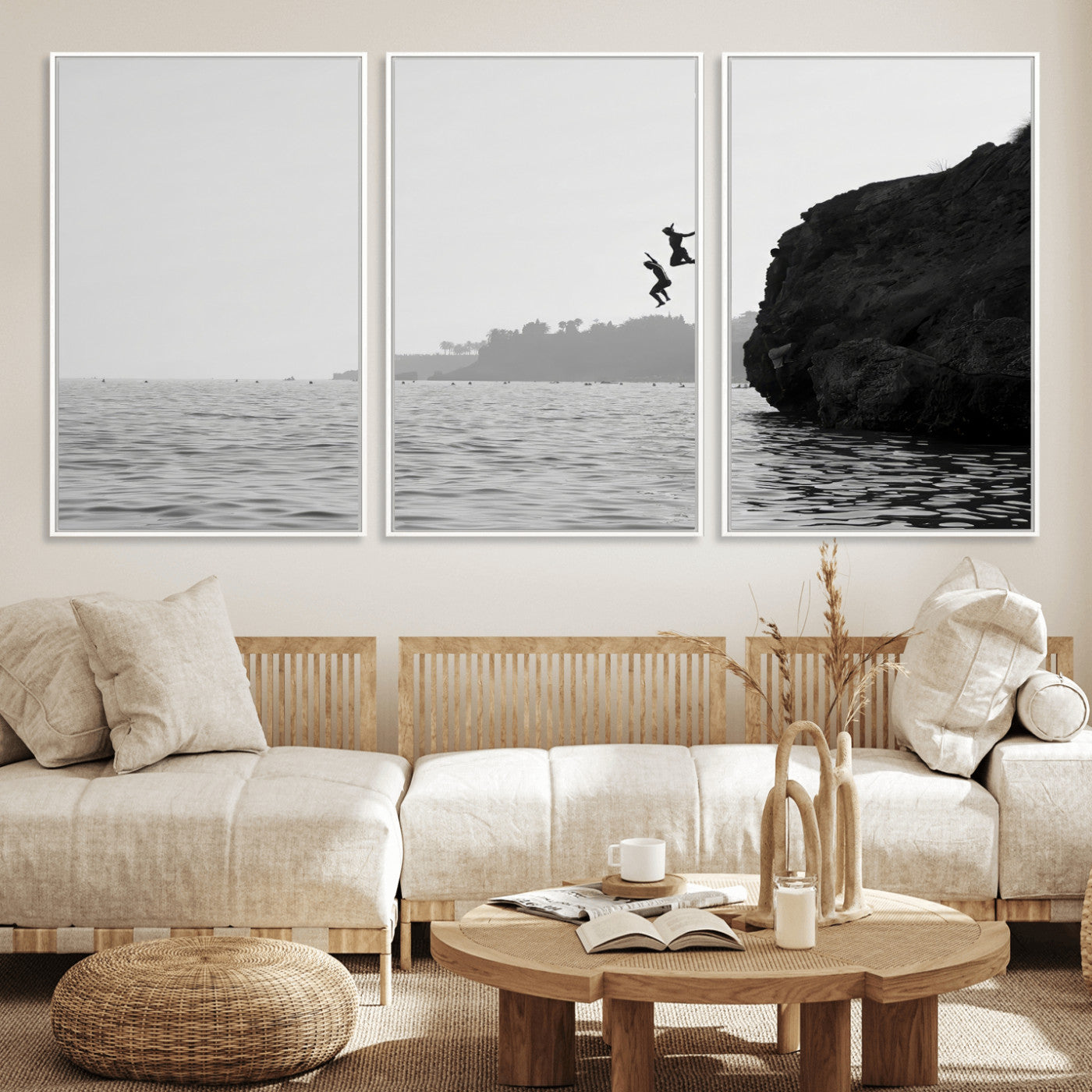 Black and white canvas of two figures cliff jumping into the sea, captured with moody tones, ideal for modern coastal or adventure-themed home decor.   2/2