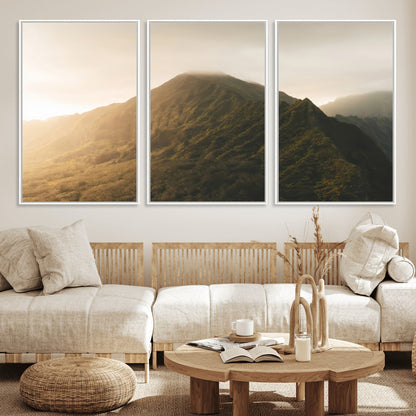Sunlit mountain peak with mist rolling over its rugged slopes, bathed in golden light, creating a warm and tranquil nature-inspired scene.