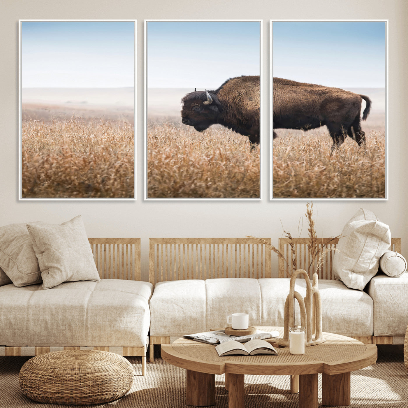 A majestic bison standing in an open prairie field, its strong form blending into the golden grass under a vast blue sky, evoking the wild spirit of the American plains.