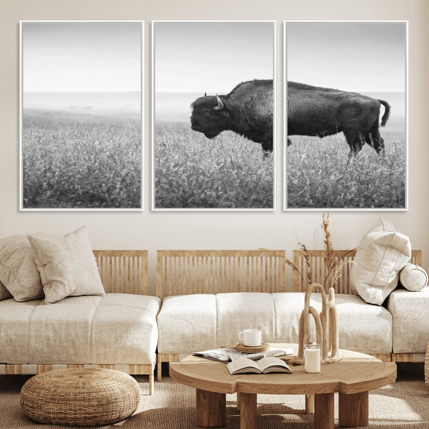 A black and white photograph of a majestic bison standing in a vast grassy prairie, evoking a sense of wilderness and strength.