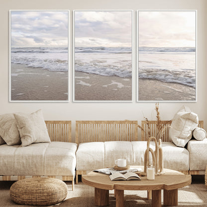Peaceful ocean waves rolling onto the sandy shore under soft light, perfect for neutral or coastal minimalist decor themes.