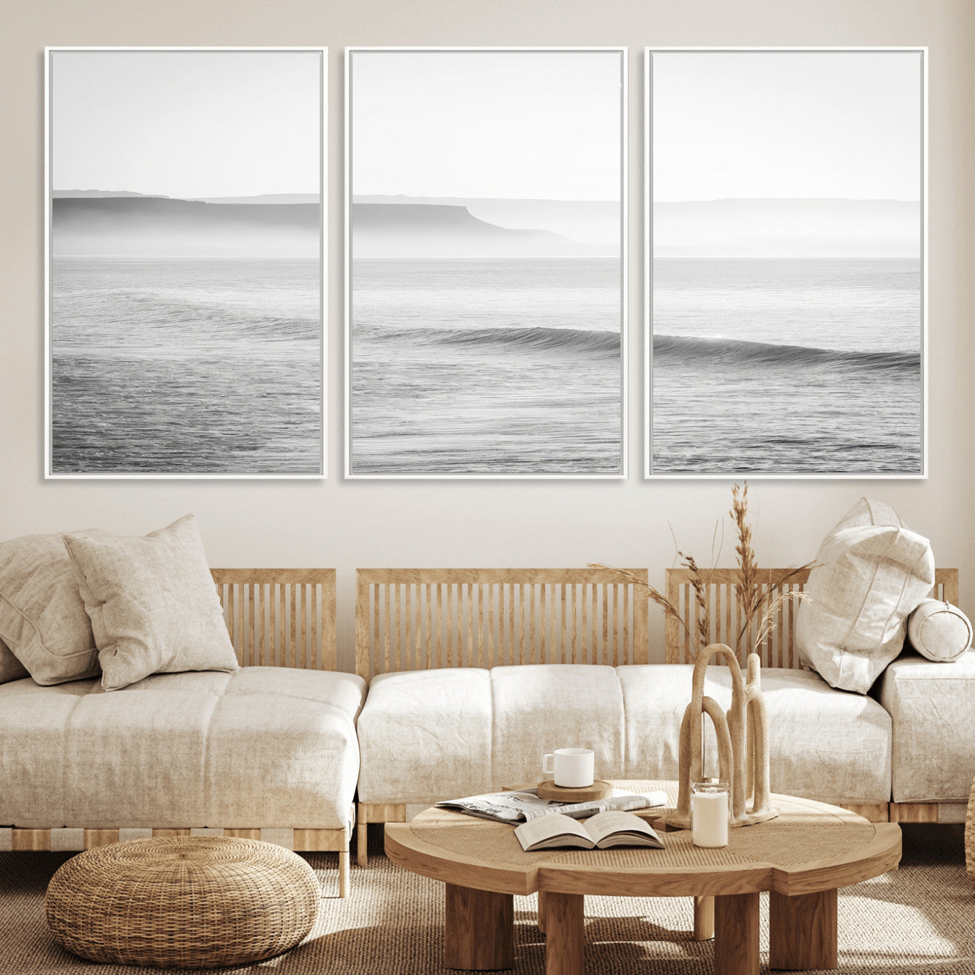 A black and white minimalist seascape featuring soft rolling waves and misty distant cliffs, creating a serene and timeless coastal atmosphere.