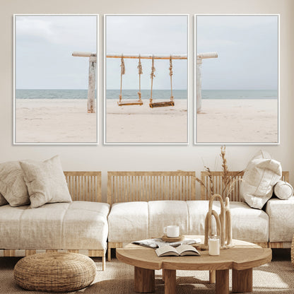 A rustic wooden beach swing stands on a serene sandy shore with an ocean horizon in the background, creating a tranquil and dreamy coastal escape.