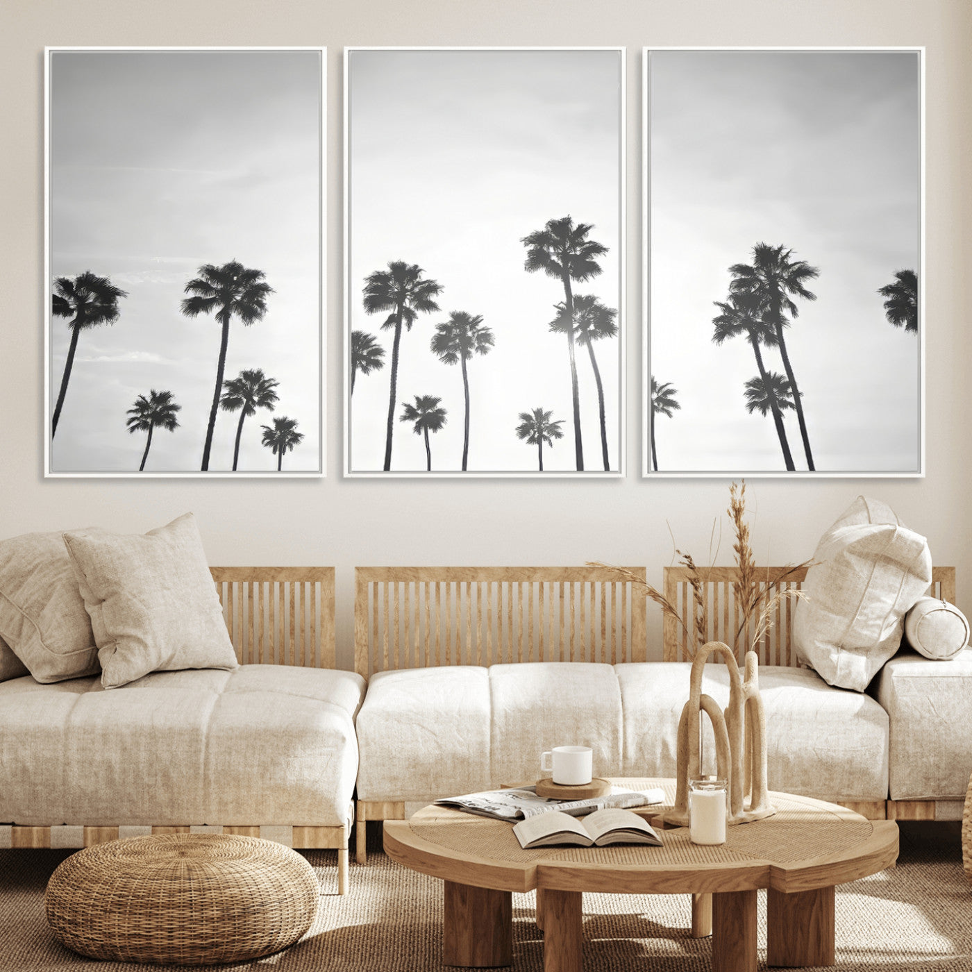 A black and white minimalist scene featuring tall palm trees silhouetted against a bright sky, creating a dreamy and timeless tropical aesthetic.