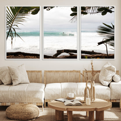 Tropical beach view with palm trees and surfer riding a wave, perfect for boho or coastal-inspired interior wall decor.