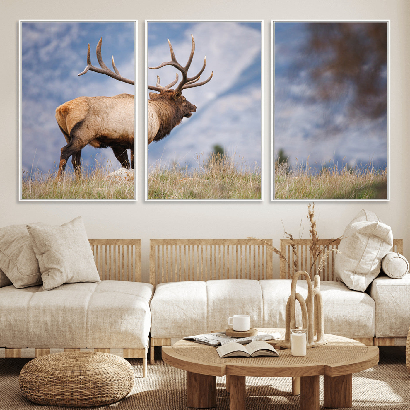 Elk with antlers standing on grass with mountain background, ideal for rustic, cabin, or lodge-inspired wall decor.