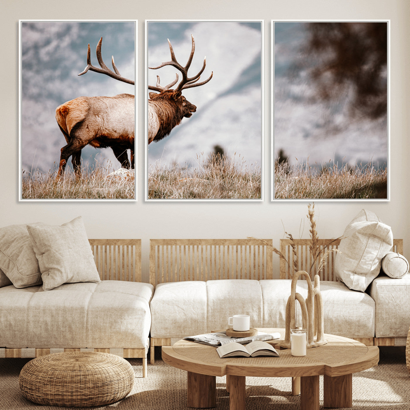 Majestic elk with large antlers standing in grass with snowy mountains in background, perfect for rustic cabin or lodge style decor.