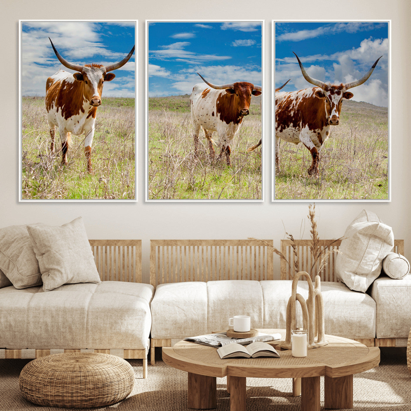 Three Texas longhorn cattle standing in dry grass under a bright blue sky, ideal for farmhouse or western rustic home decor.