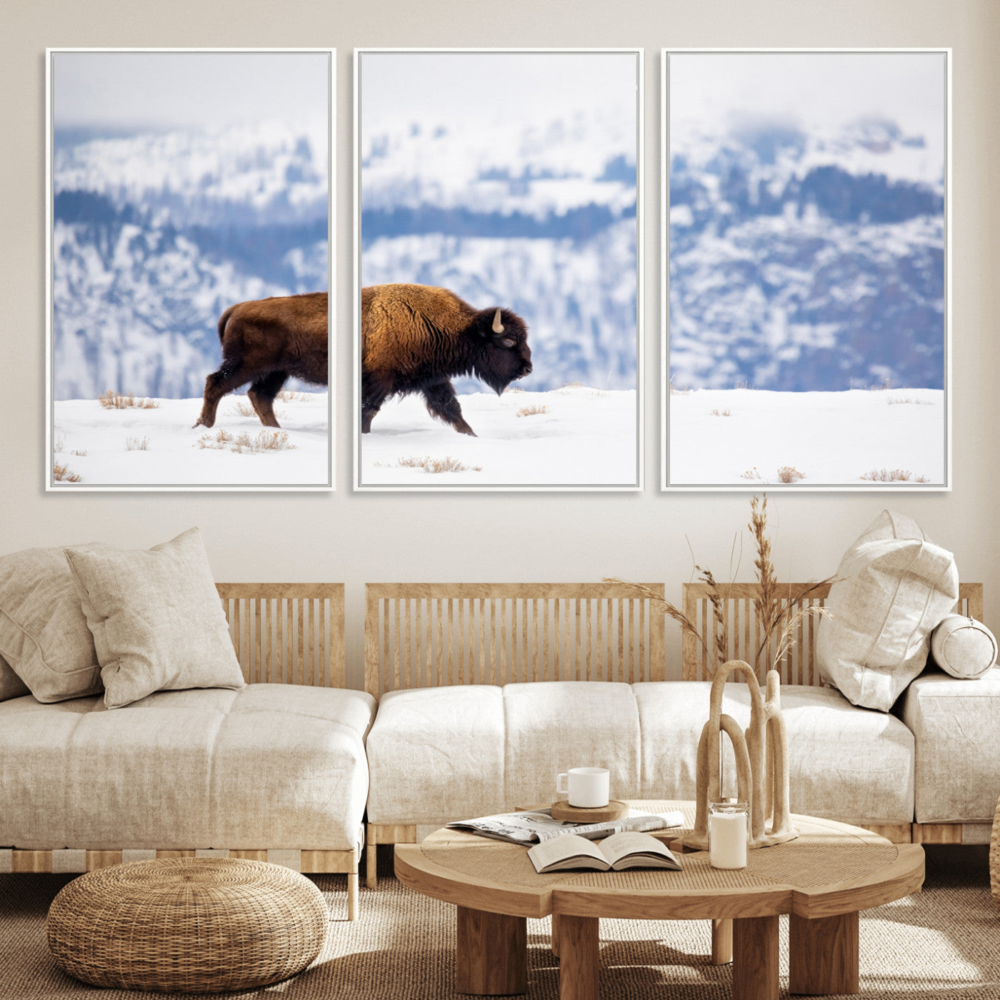 A lone bison walks across snowy ground with blue-toned mountain range behind, ideal for rustic or western farmhouse interiors.