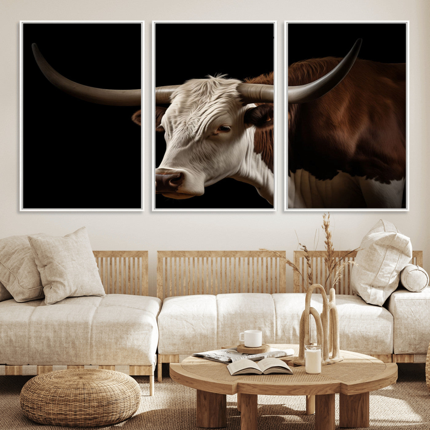 "Close-up of a brown and white longhorn cow with prominent curved horns against a black background."