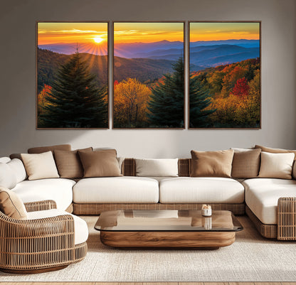 Vibrant sunset over autumn mountains with colorful trees and warm light, ideal for nature lovers or cabin-style wall decor.