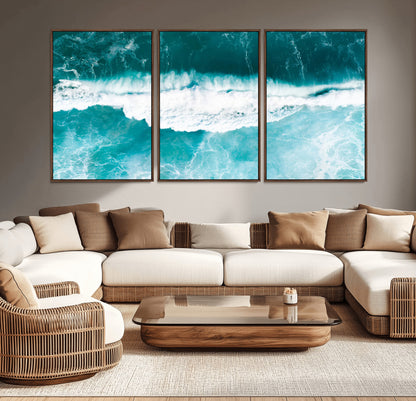 Aerial view of turquoise ocean waves crashing with white foam, perfect for tropical coastal or modern beach-style home decor.