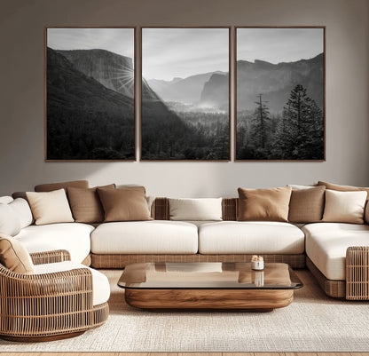 Black and white landscape of Yosemite with sun rays peeking over El Capitan, ideal for moody nature or modern rustic decor.