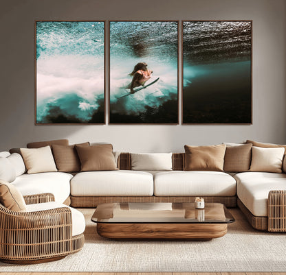 Vibrant underwater photo of a female surfer diving through turquoise waves, perfect for coastal boho or surf-inspired home decor.