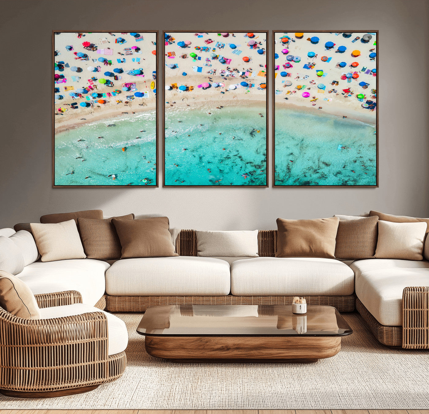 Aerial view of a vibrant beach filled with colorful umbrellas and people enjoying the turquoise ocean, capturing a lively summer vacation scene.
