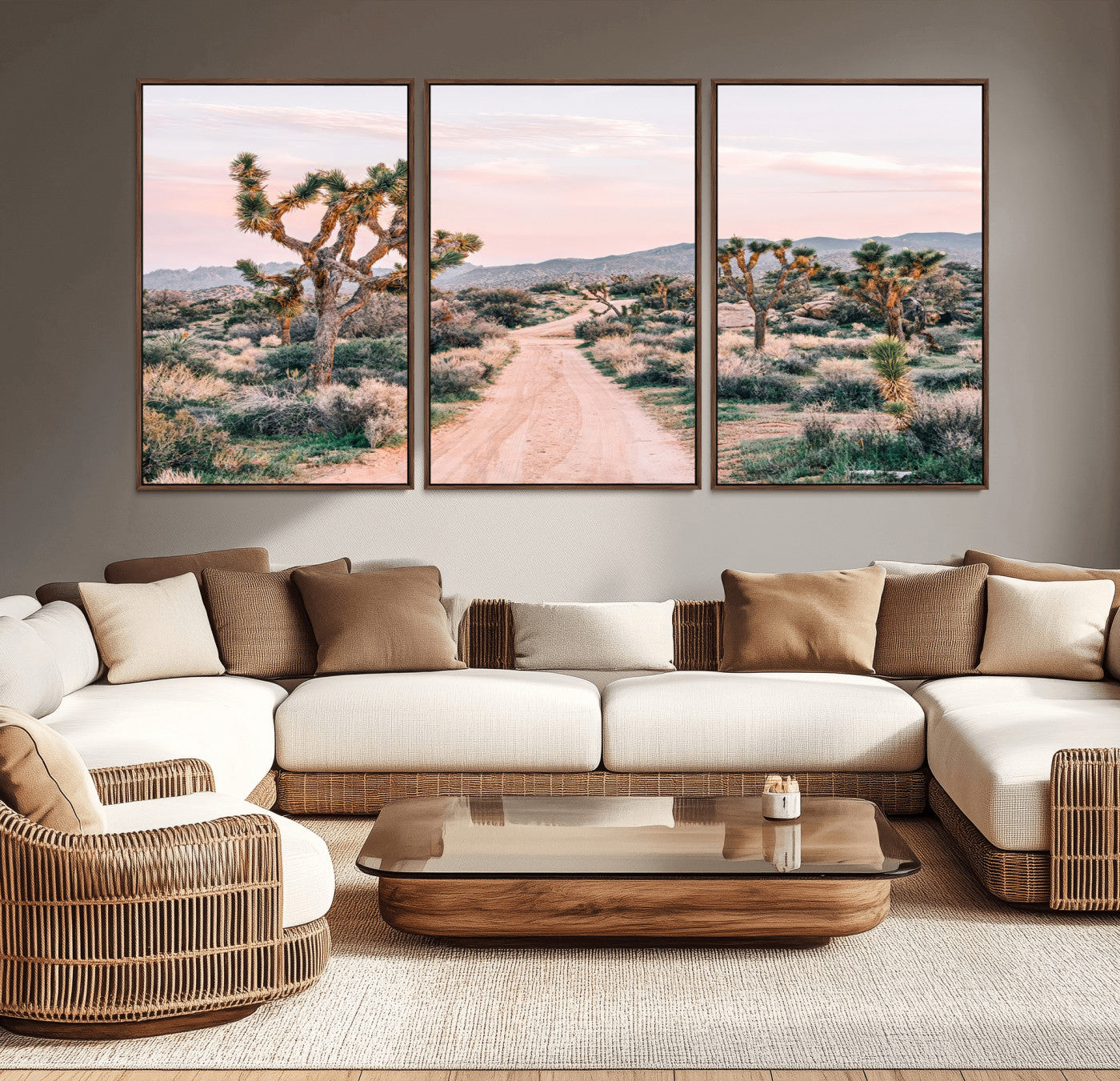 A dusty road winding through Joshua Tree National Park, framed by iconic twisted trees and warm desert tones under a soft pastel sky.