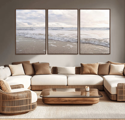 Peaceful ocean waves rolling onto the sandy shore under soft light, perfect for neutral or coastal minimalist decor themes.