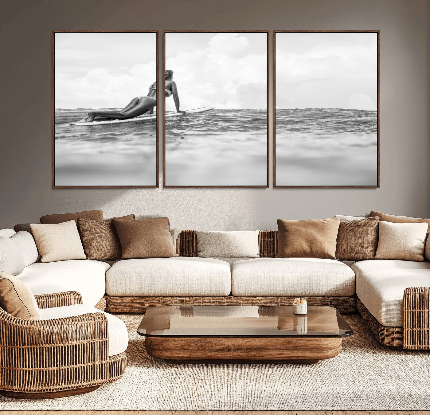 A black and white ocean scene featuring a surfer girl waiting on her board, gazing at the horizon, capturing a tranquil and adventurous coastal moment.