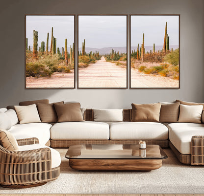 A desert road lined with saguaro cacti under a golden sky, creating a warm southwestern feel, perfect for boho or rustic decor.