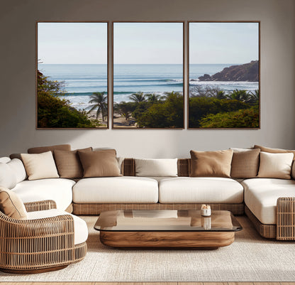View of calm ocean waves with palm trees and a tropical coastline, ideal for coastal boho or beach-themed wall decor.