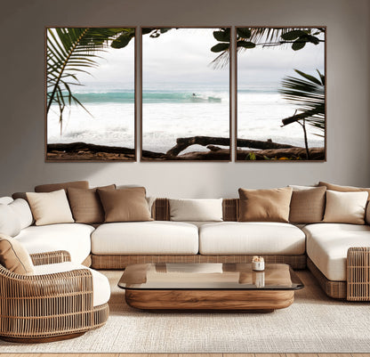 Tropical beach view with palm trees and surfer riding a wave, perfect for boho or coastal-inspired interior wall decor.