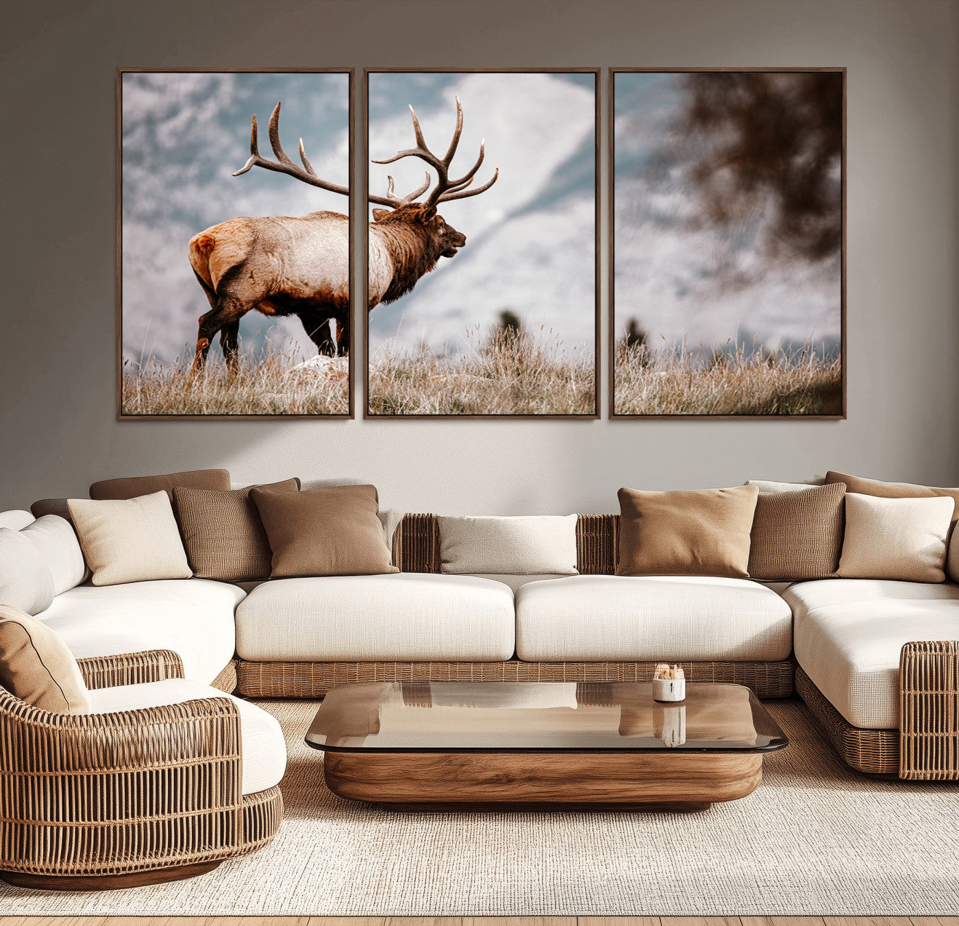 Majestic elk with large antlers standing in grass with snowy mountains in background, perfect for rustic cabin or lodge style decor.