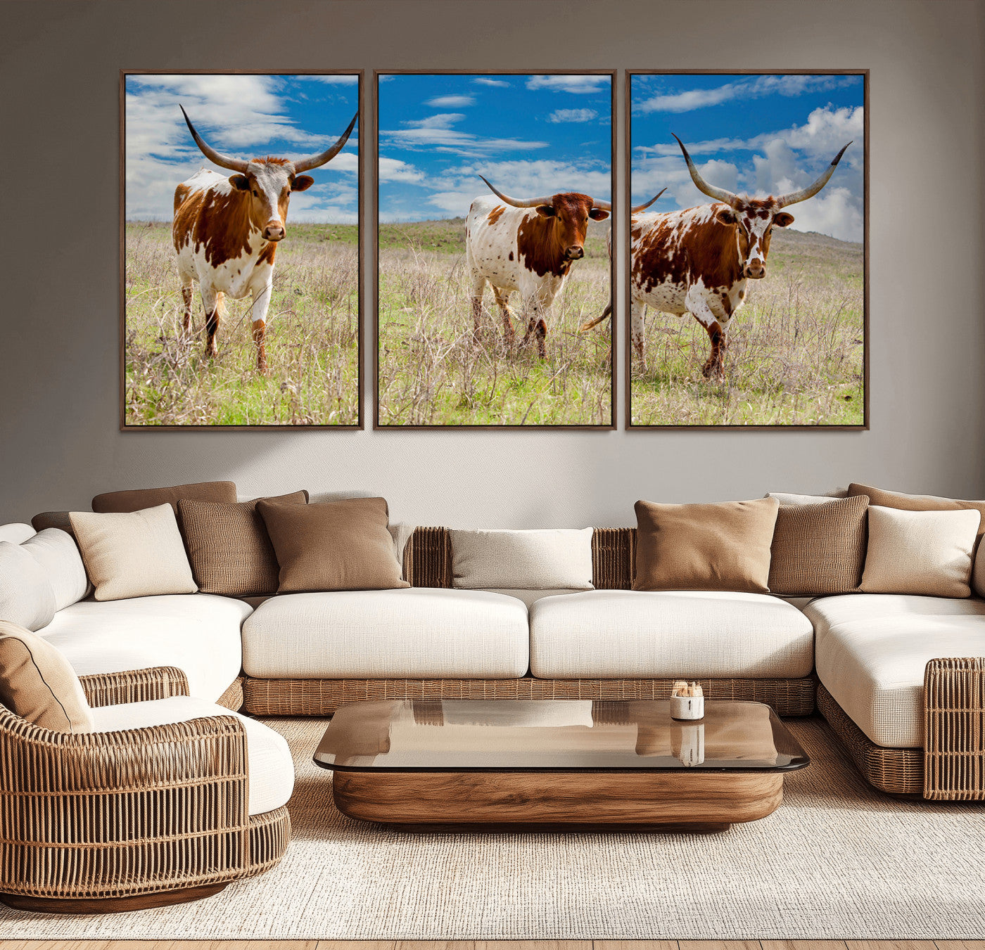 Three Texas longhorn cattle standing in dry grass under a bright blue sky, ideal for farmhouse or western rustic home decor.
