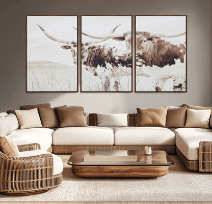 Two longhorn cows standing in a sepia-toned pasture with soft light, ideal for rustic or farmhouse-themed neutral wall decor.