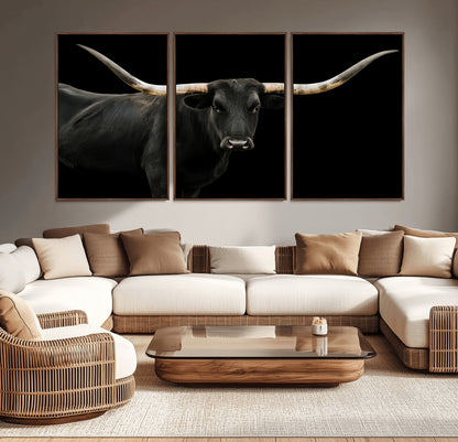 Close-up of a black Texas longhorn with large curved horns on black background, ideal for rustic farmhouse or modern western interiors.