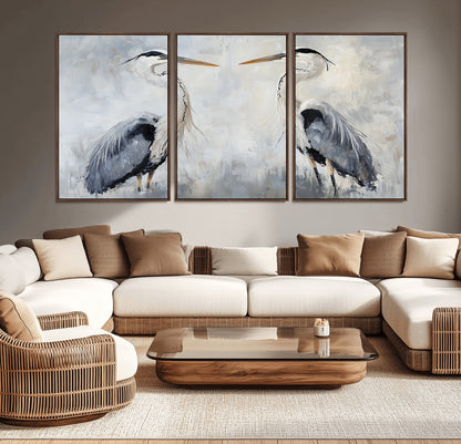 Two herons facing each other on a soft-toned background with blue-grey feathers, perfect for tranquil, coastal or nature-themed interiors.