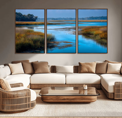 A peaceful marshland scene with calm blue water reflecting the surrounding grasses and trees, capturing the beauty of nature in a serene landscape.