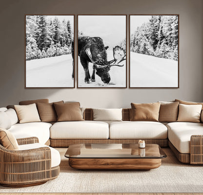 A majestic moose grazing in the snow-covered wilderness, surrounded by snow-covered trees, creating a peaceful winter scene.