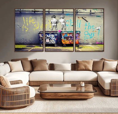 Graffiti-style canvas art with bold text and two naked figures over urban dumpsters, ideal for edgy or street-style decor.