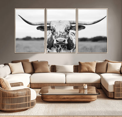 Capture the strength and elegance of nature with this striking black and white portrait of a longhorn cow. Its powerful presence makes a bold statement in any room.