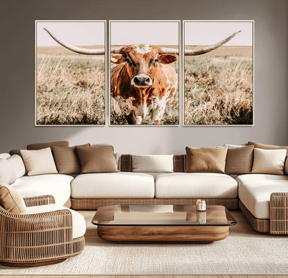 Framed longhorn cow canvas wall art with rustic prairie background, western animal print perfect for farmhouse or ranch style decor