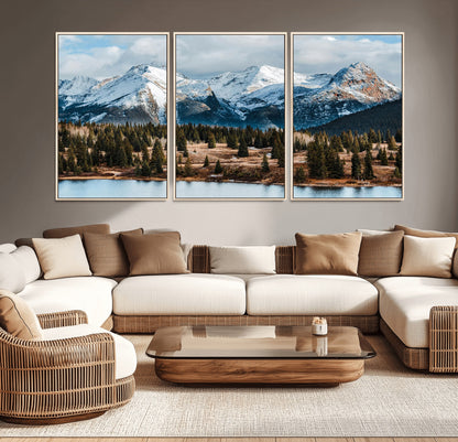Framed canvas of snowy mountain peaks with pine forest and alpine lake, perfect for winter cabin or wilderness-inspired home decor.