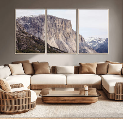 Framed canvas of El Capitan’s vertical granite face in Yosemite with snowy peaks, ideal for Sierra minimalism or mountain-inspired decor.
