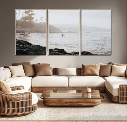 Framed canvas of a surfer in misty coastal tones at a foggy California beach, ideal for minimalist coastal beach or serene ocean-themed decor.