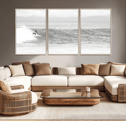 Monochrome photo of a surfer riding a wave with distant mountains, ideal for coastal motion or black and white surf-themed wall decor.