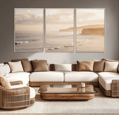 Golden hour seascape with misty cliffs and gentle waves rolling towards the shore, capturing a tranquil and warm coastal atmosphere.