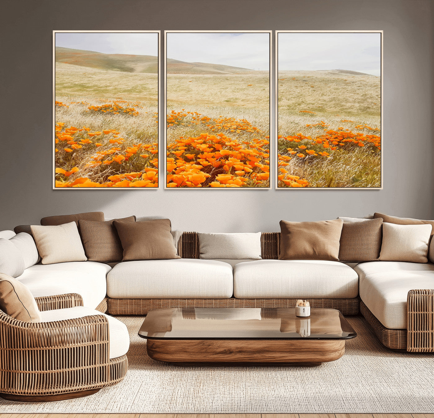 A golden field with vibrant orange poppies blooming across rolling hills under a soft, sunlit sky, creating a warm and rustic landscape.