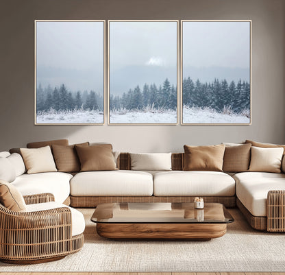 Snow-covered forest under misty sky, soft light breaking through clouds, ideal for minimalist or Nordic-inspired home decor.