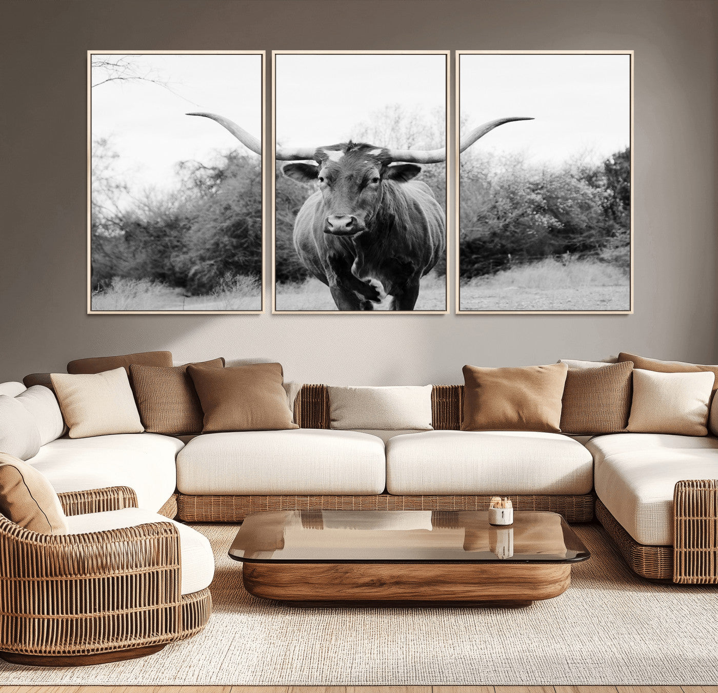 Black and white photo of a longhorn cow in a field, perfect for rustic farmhouse or western-themed interior wall decoration.