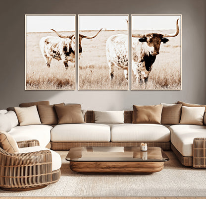 Two Texas longhorn cows standing in a sepia-toned pasture, evoking rustic charm perfect for farmhouse or western country interiors. (