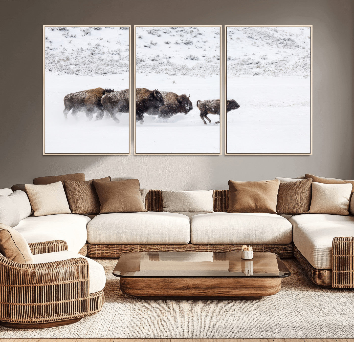 Bison herd running through a snowy open field with mountain backdrop, perfect for rustic or western-themed wall decoration.