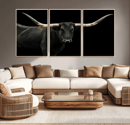 Close-up of a black Texas longhorn with large curved horns on black background, ideal for rustic farmhouse or modern western interiors.