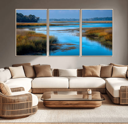 A peaceful marshland scene with calm blue water reflecting the surrounding grasses and trees, capturing the beauty of nature in a serene landscape.